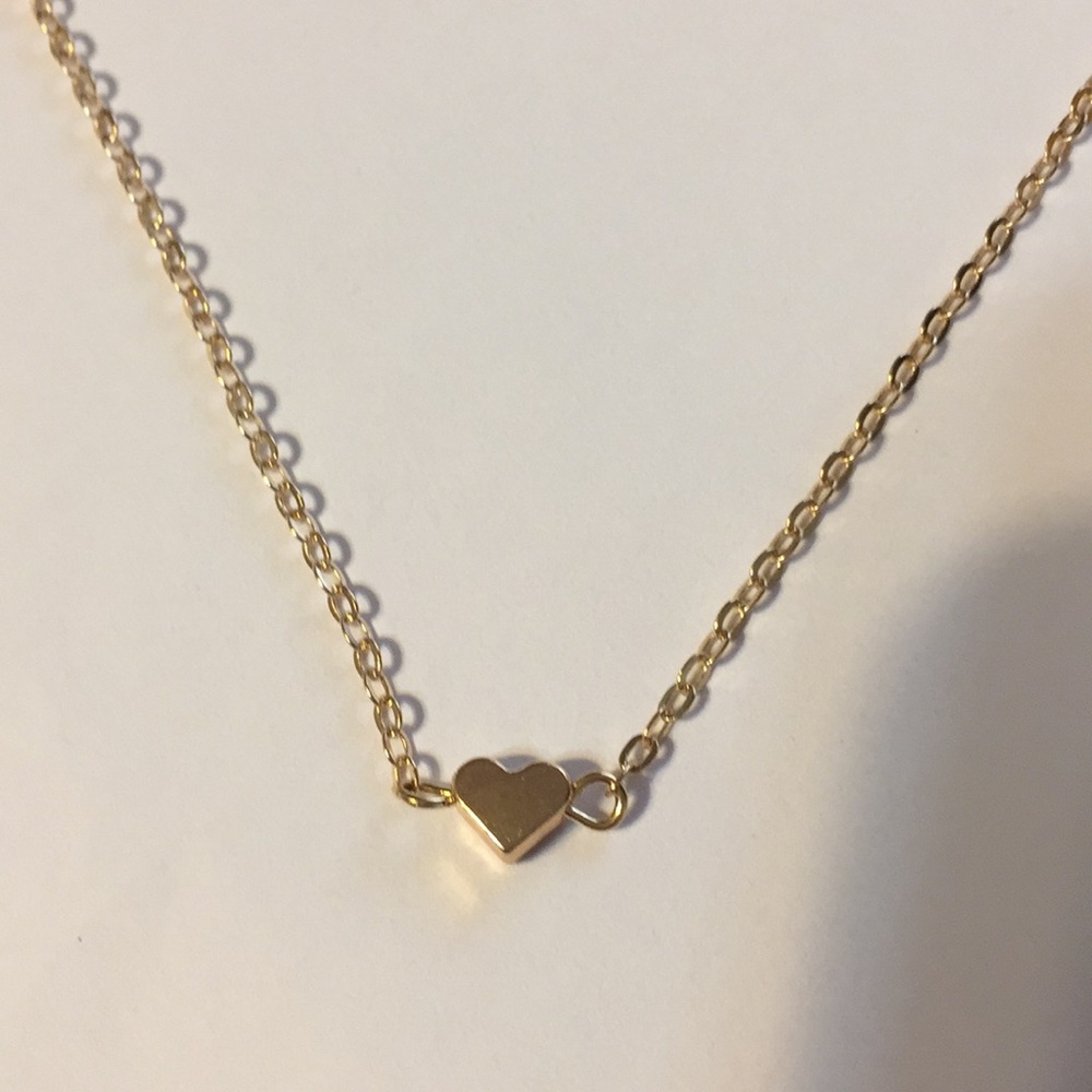 Gold tone necklace with heart detail